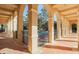 Covered walkway with arches offering a view of the community pool at 114 Medici Ter, North Venice, FL 34275