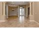 Elegant entryway with high ceilings and a chandelier at 114 Medici Ter, North Venice, FL 34275