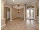 Spacious entryway featuring high ceilings and decorative artwork at 114 Medici Ter, North Venice, FL 34275