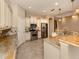 Modern kitchen with stainless steel appliances and granite countertops at 114 Medici Ter, North Venice, FL 34275