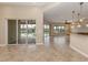 Open kitchen with island, granite counters, and stainless steel appliances at 114 Medici Ter, North Venice, FL 34275