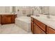 Primary bathroom with soaking tub, walk-in shower, and double vanity at 11584 Dancing River Dr, Venice, FL 34292