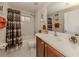 Clean bathroom with tub, shower, and updated vanity at 11584 Dancing River Dr, Venice, FL 34292
