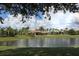 Community clubhouse near a pond at 11584 Dancing River Dr, Venice, FL 34292