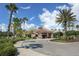 Community center with palm trees and circular drive at 11584 Dancing River Dr, Venice, FL 34292