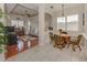 Casual dining area with hardwood floors and view into living room at 11584 Dancing River Dr, Venice, FL 34292