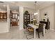 Formal dining room with modern table and chairs, adjacent to kitchen at 11584 Dancing River Dr, Venice, FL 34292