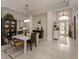Bright dining room with modern table and chairs at 11584 Dancing River Dr, Venice, FL 34292
