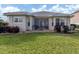 Charming house exterior with well-maintained lawn at 11584 Dancing River Dr, Venice, FL 34292