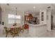Bright kitchen features a breakfast nook, island, and modern appliances at 11584 Dancing River Dr, Venice, FL 34292