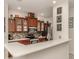 Modern kitchen with stainless steel appliances and wood cabinets at 11584 Dancing River Dr, Venice, FL 34292