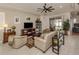 Relaxing living room with ample seating and a view to backyard at 11584 Dancing River Dr, Venice, FL 34292
