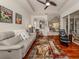 Relaxing living room with hardwood floors and view into the dining area at 11584 Dancing River Dr, Venice, FL 34292