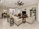 Open living room with a view to kitchen and dining area at 11584 Dancing River Dr, Venice, FL 34292