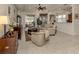Spacious living room with comfortable seating and large windows at 11584 Dancing River Dr, Venice, FL 34292