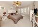 Main bedroom with a large window, ceiling fan, and ample closet space at 11584 Dancing River Dr, Venice, FL 34292