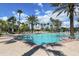 Resort-style pool with lounge chairs and palm trees at 11584 Dancing River Dr, Venice, FL 34292