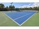 Two well-maintained tennis courts at 11584 Dancing River Dr, Venice, FL 34292