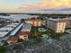 Aerial view of waterfront condominiums with boat docks and pool at 1200 Tarpon Center Dr # 108, Venice, FL 34285