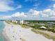 Expansive beach aerial view with condos and open sky at 1200 Tarpon Center Dr # 108, Venice, FL 34285