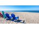 Relaxing beach view with colorful chairs overlooking the clear ocean water at 1200 Tarpon Center Dr # 108, Venice, FL 34285