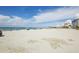 Expansive beach view featuring sandy shores, clear skies, and sparkling water at 1200 Tarpon Center Dr # 108, Venice, FL 34285