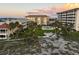 Aerial shot of condominiums with pool and manicured lawns at 1200 Tarpon Center Dr # 108, Venice, FL 34285
