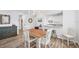 Dining area overlooking modern kitchen; great for gatherings at 1200 Tarpon Center Dr # 108, Venice, FL 34285