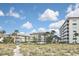 Well-maintained condominium buildings with lush landscaping, offering serene views at 1200 Tarpon Center Dr # 108, Venice, FL 34285