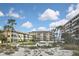 Well-maintained condominium buildings with lush landscaping, offering serene views at 1200 Tarpon Center Dr # 108, Venice, FL 34285