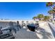 Beachside fire pit with comfortable seating for cozy evenings under the stars at 1200 Tarpon Center Dr # 108, Venice, FL 34285