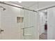 Shower with glass enclosure, white subway tile, and built-in seat at 1200 Tarpon Center Dr # 108, Venice, FL 34285