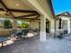 Covered patio area with tables and chairs near the pool at 12000 Blazing Star Dr, Venice, FL 34293