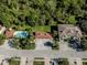 Community view including pool, garages, and building at 121 Preserve Pl # A, Nokomis, FL 34275