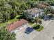 Aerial view of a beautiful home with a detached garage at 121 Preserve Pl # A, Nokomis, FL 34275