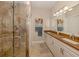 Bathroom with double vanity, granite countertop, and large shower at 121 Preserve Pl # A, Nokomis, FL 34275