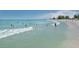 Beach with people swimming and enjoying the water at 121 Preserve Pl # A, Nokomis, FL 34275