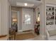 Bright entryway with built-in shelving and a view to living room at 121 Preserve Pl # A, Nokomis, FL 34275