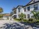 Building exterior with attached garage and landscaping at 121 Preserve Pl # A, Nokomis, FL 34275