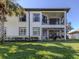 Two-story condo building with screened balcony and lush landscaping at 121 Preserve Pl # A, Nokomis, FL 34275