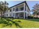 Two-story building with screened balcony and lush lawn at 121 Preserve Pl # A, Nokomis, FL 34275