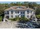 Two-story building with tile roofs, balconies, and parking at 121 Preserve Pl # A, Nokomis, FL 34275