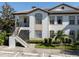 Two-story building exterior with stairs and landscaping at 121 Preserve Pl # A, Nokomis, FL 34275