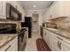 Clean kitchen with granite countertops and stainless steel appliances at 121 Preserve Pl # A, Nokomis, FL 34275