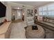 Open living room showcasing a tiled floor and access to other rooms at 121 Preserve Pl # A, Nokomis, FL 34275