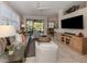 Bright living room with comfy seating and large TV at 121 Preserve Pl # A, Nokomis, FL 34275