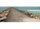 Fishing pier extending into the ocean, great for relaxing or fishing at 121 Preserve Pl # A, Nokomis, FL 34275