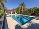 Relaxing community pool with patio and lounge chairs at 121 Preserve Pl # A, Nokomis, FL 34275