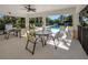 Relaxing poolside patio furniture with view of the pool at 121 Preserve Pl # A, Nokomis, FL 34275