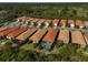 Aerial view of community with houses, roads, and lush green landscape at 125 Soliera St, Nokomis, FL 34275